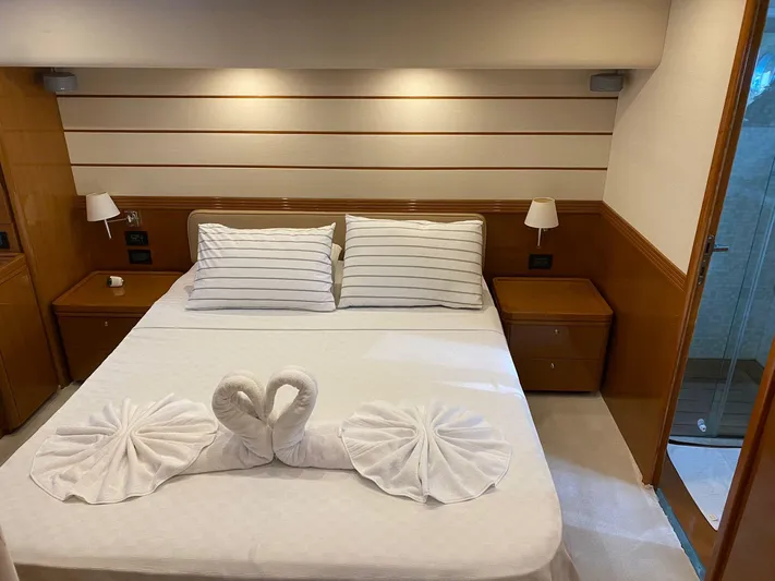  Yacht Photos Pics Luxurious bedroom on 2013 Apreamare Maestro 65 yacht with elegant swan towel art.