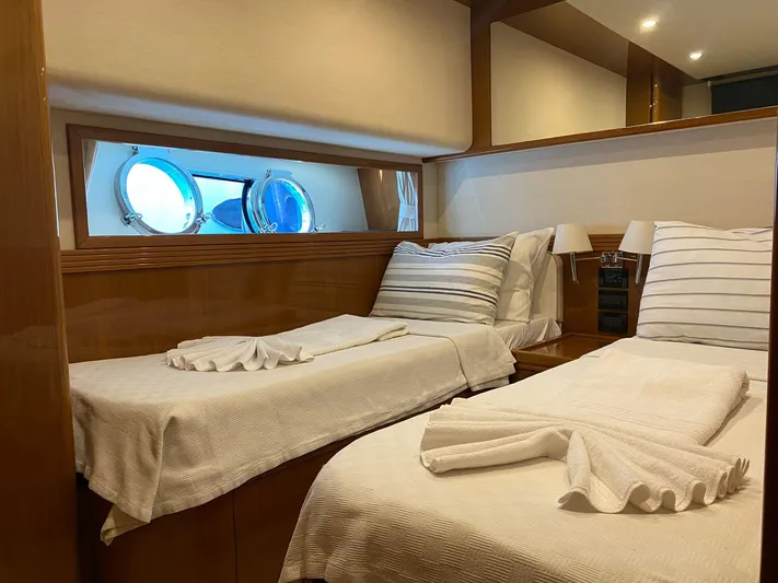  Yacht Photos Pics Twin cabin interior of 2013 Apreamare Maestro 65 yacht with porthole windows.