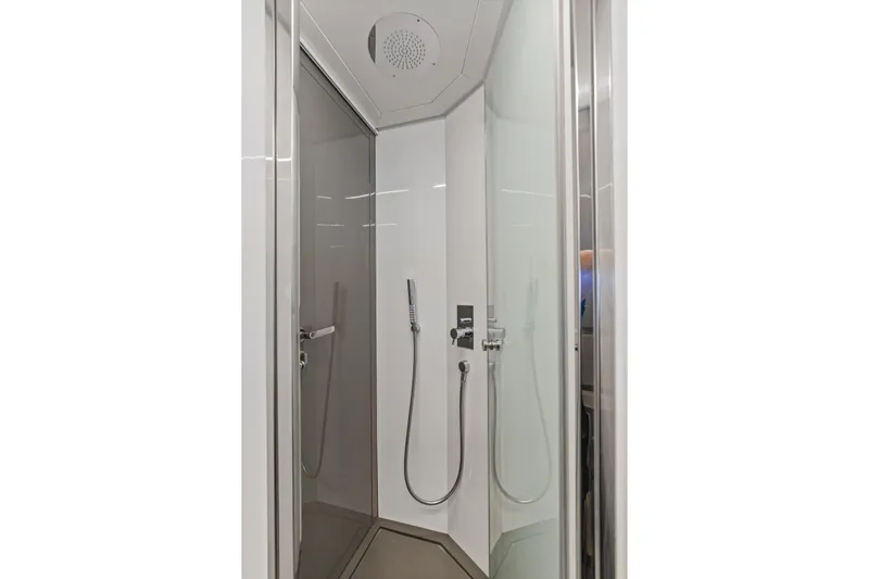  Yacht Photos Pics Modern shower cabin in a 2016 Pershing 62' yacht, featuring sleek design and fixtures.