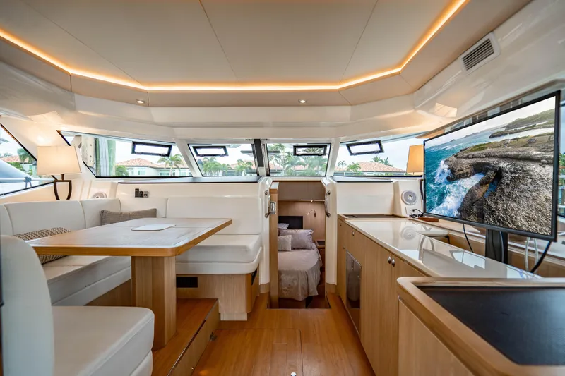 Altair Yacht Photos Pics Luxurious interior of 2019 Aquila 44 Yacht with modern furnishings and large windows.