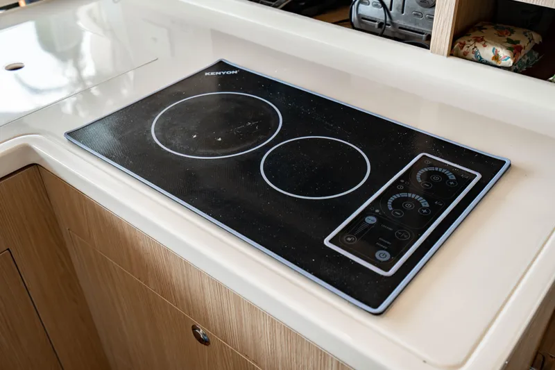 Altair Yacht Photos Pics Modern induction cooktop on 2019 Aquila 44 Yacht's kitchen counter.