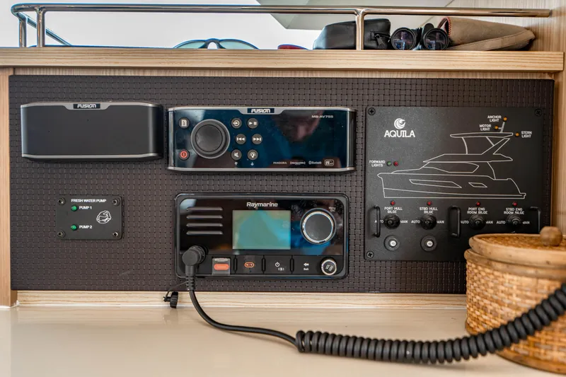 Altair Yacht Photos Pics Control panel of a 2019 Aquila 44 Yacht featuring navigation and audio systems.