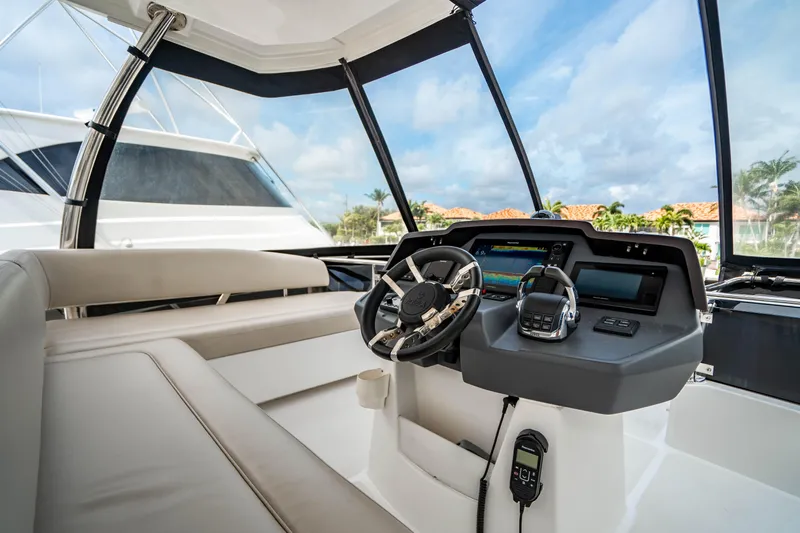 Altair Yacht Photos Pics 2019 Aquila 44 Yacht helm with modern controls and panoramic view.
