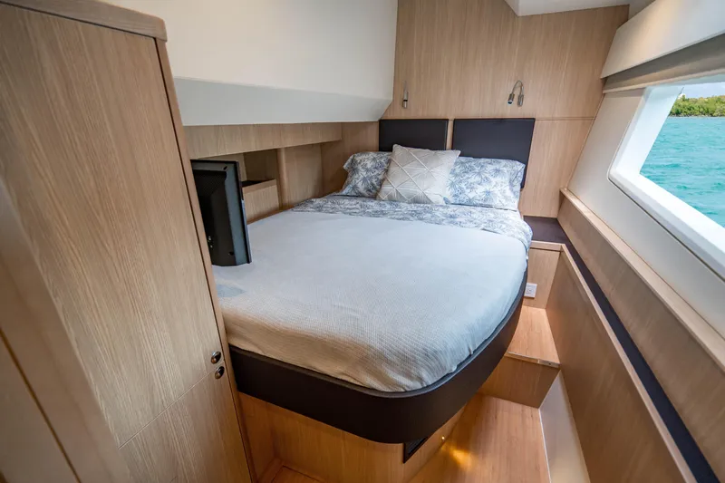 Altair Yacht Photos Pics Luxurious bedroom interior of 2019 Aquila 44 Yacht with modern design and ocean view.