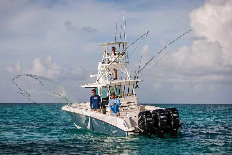  Yacht Photos Pics Manufacturer Provided Image: 2020 Boston Whaler 350 Outrage fishing boat with triple engines on open water.