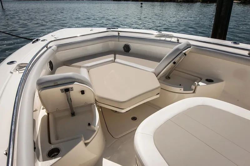  Yacht Photos Pics Manufacturer Provided Image: 2020 Boston Whaler 350 Outrage boat interior with cushioned seating and table.