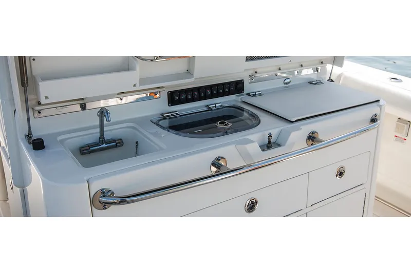  Yacht Photos Pics Manufacturer Provided Image: Boston Whaler 350 Outrage 2020 boat galley with sink and storage.