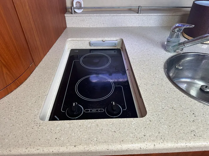 Five Too Soon Yacht Photos Pics 2008 Tiara Yachts 3500 Sovran kitchen with electric stove and sink.