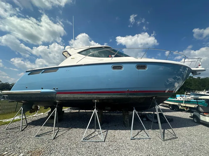Five Too Soon Yacht Photos Pics 2008 Tiara Yachts 3500 Sovran on stands under a blue sky.