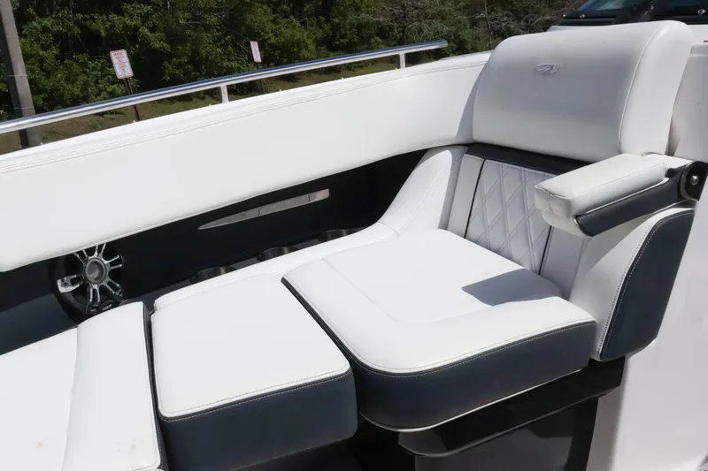  Yacht Photos Pics 2019 Regal 29 OBX boat interior with luxurious white seating and armrest.
