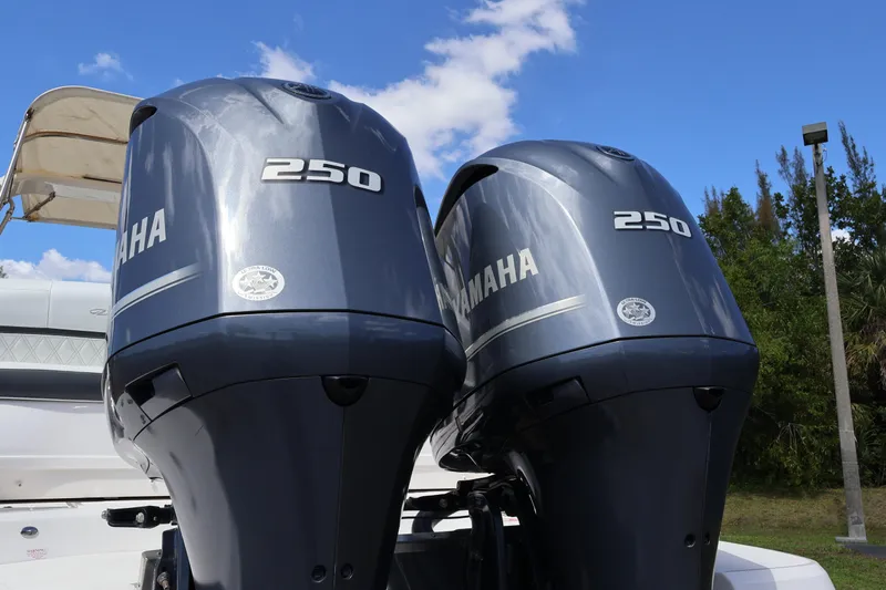  Yacht Photos Pics Twin Yamaha 250 outboard engines on a 2019 Regal 29 OBX boat under blue sky.