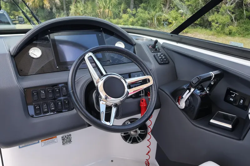 Yacht Photos Pics 2019 Regal 29 OBX boat dashboard with steering wheel and control panel.