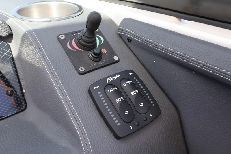  Yacht Photos Pics Control panel of a 2019 Regal 29 OBX boat with joystick and trim tabs.