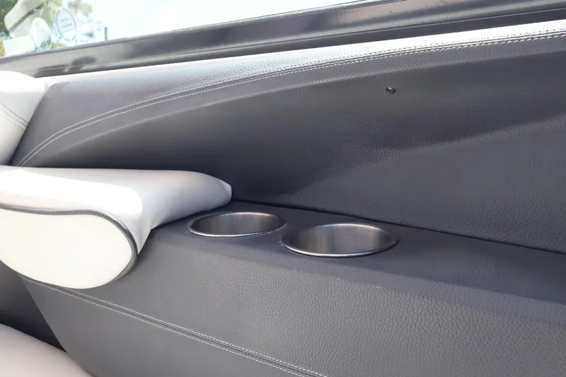  Yacht Photos Pics 2019 Regal 29 OBX boat interior with cup holders and armrest detail.
