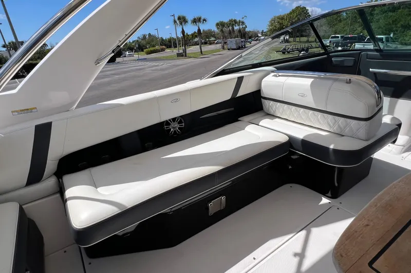  Yacht Photos Pics 2019 Regal 29 OBX boat interior with white seating and sleek design.