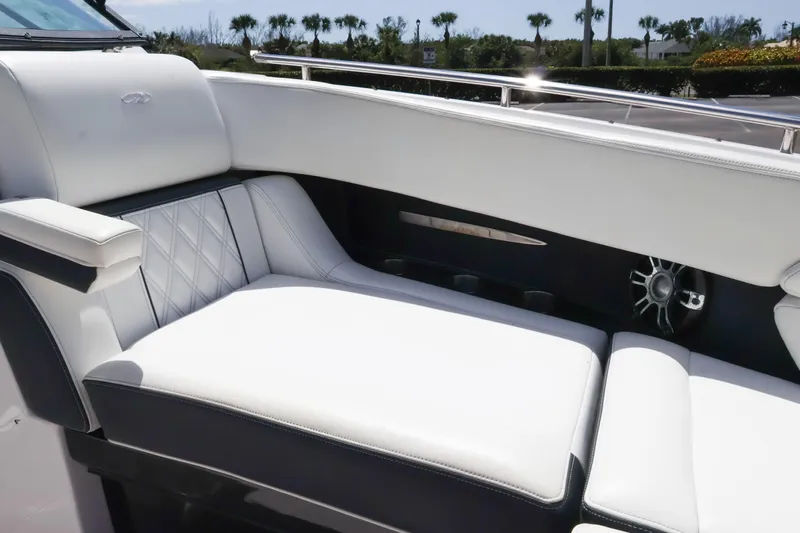  Yacht Photos Pics Luxurious seating on 2019 Regal 29 OBX boat with white upholstery and elegant design.