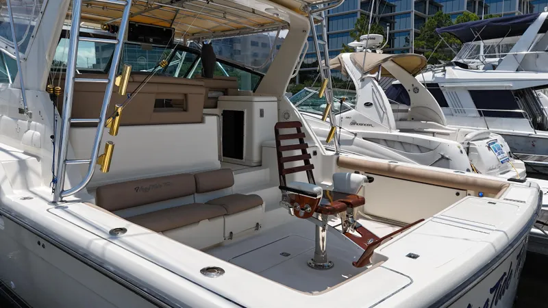 Hoggtide Two Yacht Photos Pics 1998 Tiara Yachts 4100 Open boat with spacious deck and fishing chair.
