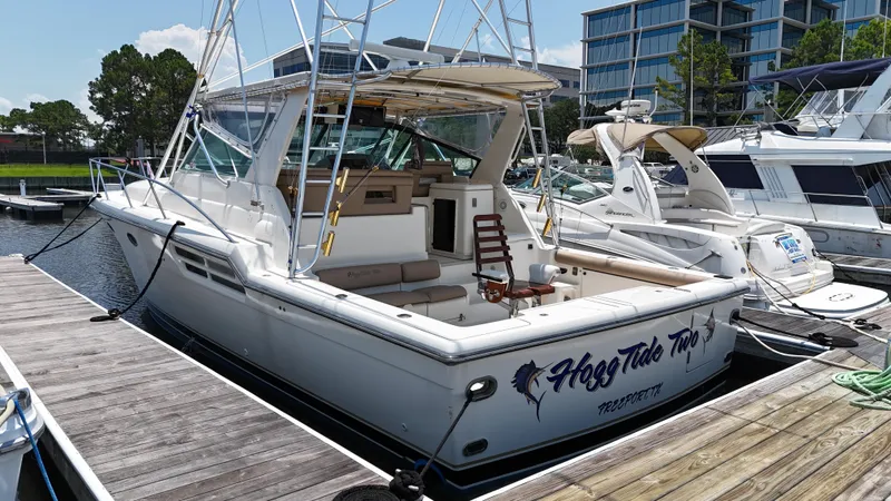 Hoggtide Two Yacht Photos Pics 1998 Tiara Yachts 4100 Open docked at marina, rear view.