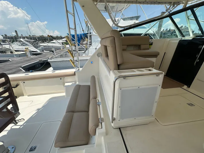 Hoggtide Two Yacht Photos Pics 1998 Tiara Yachts 4100 Open boat interior with seating and dock view.