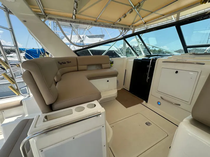 Hoggtide Two Yacht Photos Pics 1998 Tiara Yachts 4100 Open interior with beige seating and helm station.