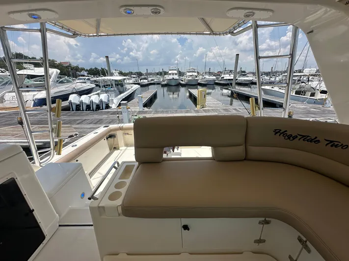 Hoggtide Two Yacht Photos Pics 1998 Tiara Yachts 4100 Open at marina, featuring spacious seating and dock view.