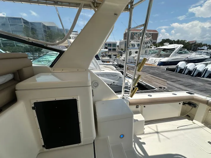 Hoggtide Two Yacht Photos Pics 1998 Tiara Yachts 4100 Open at marina, showcasing cockpit and seating area.