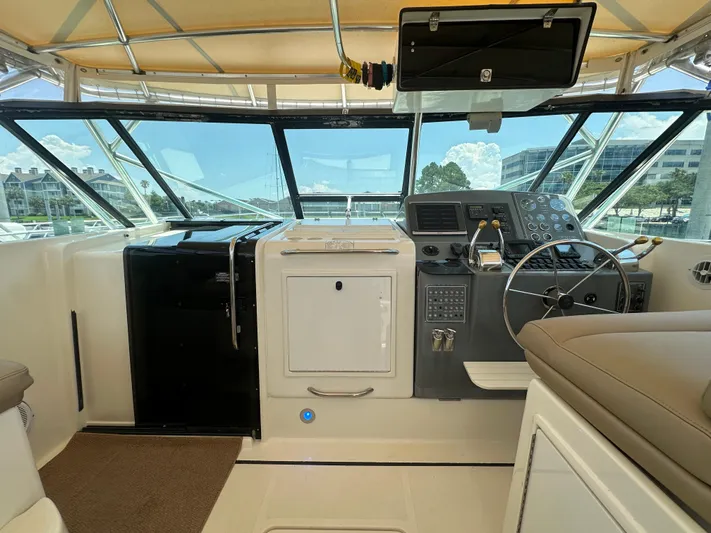 Hoggtide Two Yacht Photos Pics 1998 Tiara Yachts 4100 Open helm station with modern controls and panoramic windows.