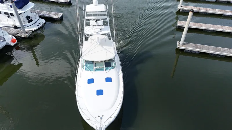 Hoggtide Two Yacht Photos Pics Aerial view of 1998 Tiara Yachts 4100 Open docked in marina.