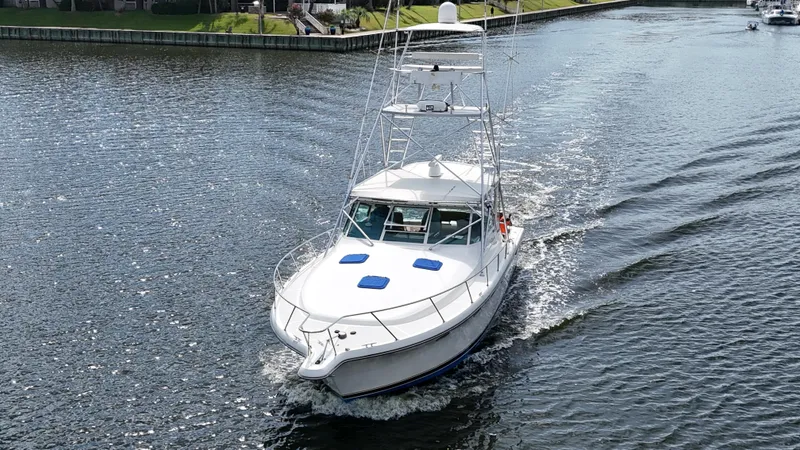 Hoggtide Two Yacht Photos Pics 1998 Tiara Yachts 4100 Open cruising on a calm river.