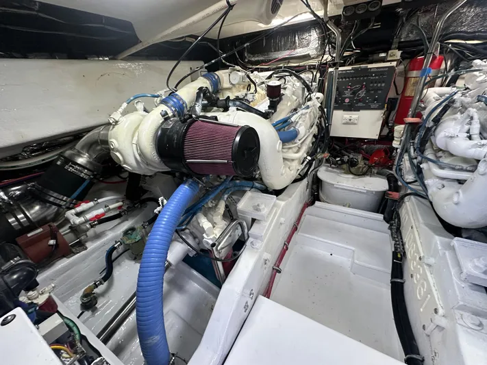 Hoggtide Two Yacht Photos Pics Engine room of 1998 Tiara Yachts 4100 Open, showcasing detailed mechanical components.