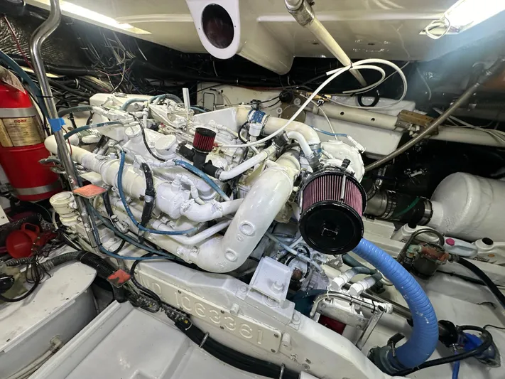 Hoggtide Two Yacht Photos Pics Engine room of 1998 Tiara Yachts 4100 Open, showcasing detailed mechanical components.