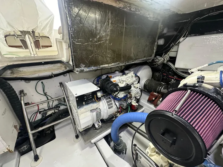 Hoggtide Two Yacht Photos Pics Engine room of 1998 Tiara Yachts 4100 Open, showcasing mechanical components and wiring.