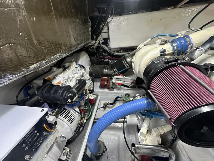 Hoggtide Two Yacht Photos Pics Engine room of 1998 Tiara Yachts 4100 Open, showcasing mechanical components and filters.