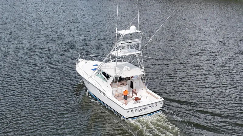 Hoggtide Two Yacht Photos Pics 1998 Tiara Yachts 4100 Open cruising on the water.