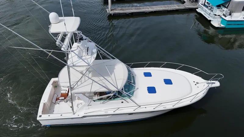 Hoggtide Two Yacht Photos Pics 1998 Tiara Yachts 4100 Open boat docked in marina, aerial view.