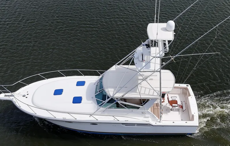 Hoggtide Two Yacht Photos Pics 1998 Tiara Yachts 4100 Open cruising on water, aerial view.