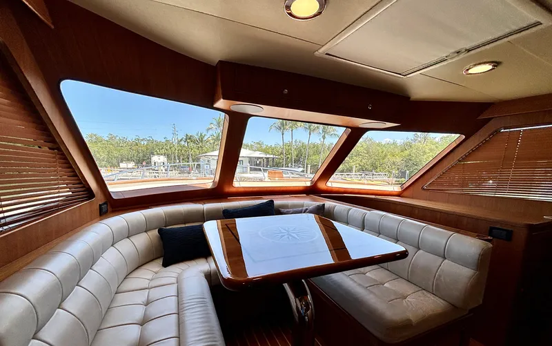 Forever Fun Yacht Photos Pics Luxurious interior of 2018 Marlow 53E CB yacht with plush seating and panoramic windows.