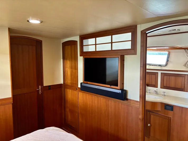 Forever Fun Yacht Photos Pics Luxurious Marlow 53E CB 2018 yacht interior with wood paneling and modern amenities.