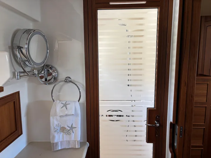 Forever Fun Yacht Photos Pics Luxurious Marlow 53E CB yacht bathroom with frosted glass door and elegant towel rack, 2018 model.