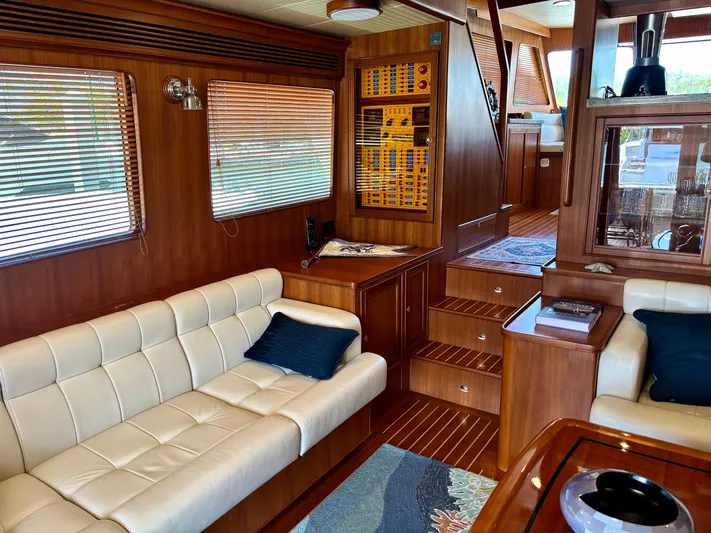 Forever Fun Yacht Photos Pics Luxurious 2018 Marlow 53E CB yacht interior with elegant wood finish and comfortable seating.