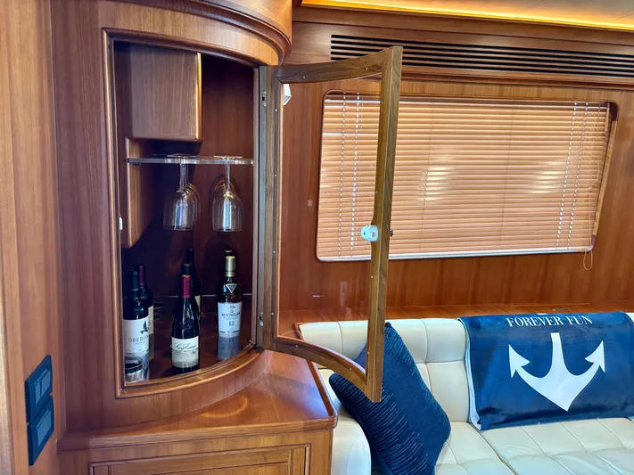 Forever Fun Yacht Photos Pics Luxurious Marlow 53E CB yacht interior with wine cabinet and cozy seating, 2018 model.