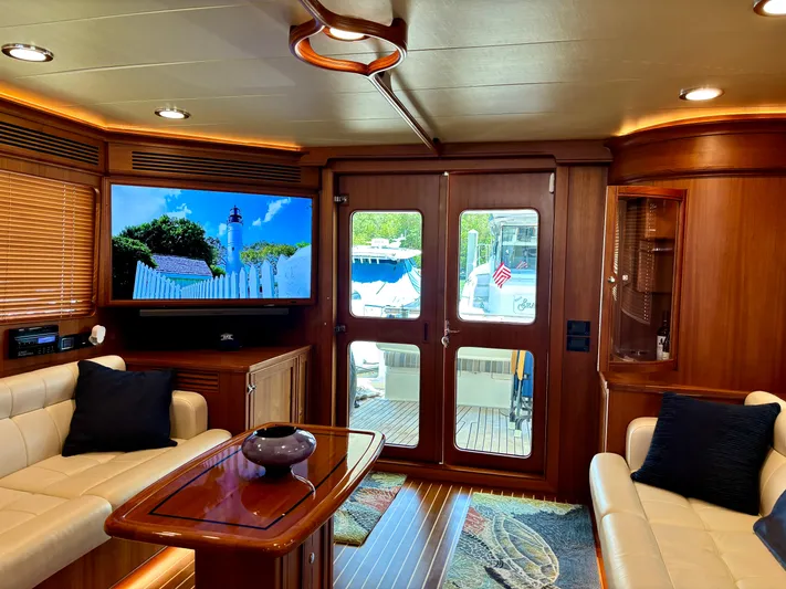 Forever Fun Yacht Photos Pics Luxurious interior of 2018 Marlow 53E CB yacht with elegant seating and entertainment system.