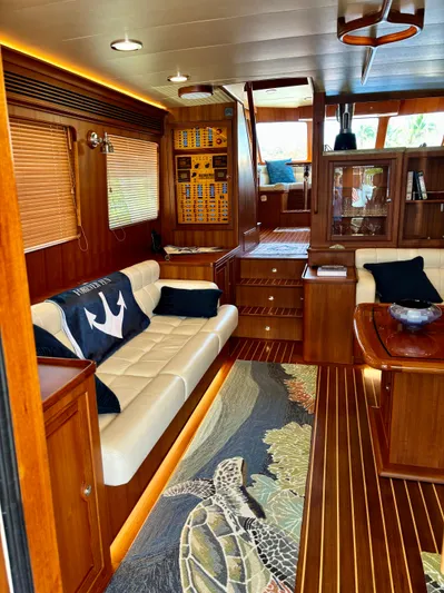 Forever Fun Yacht Photos Pics Luxurious Marlow 53E CB yacht interior with elegant wood finish and comfortable seating, 2018 model.