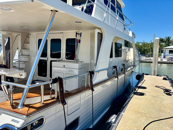 Forever Fun Yacht Photos Pics 2018 Marlow 53E CB yacht docked at marina, featuring sleek design and spacious deck.