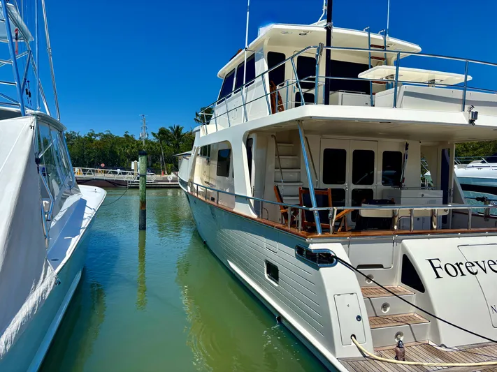 Forever Fun Yacht Photos Pics Luxury Marlow 53E CB yacht docked in marina, 2018 model, sunny day.
