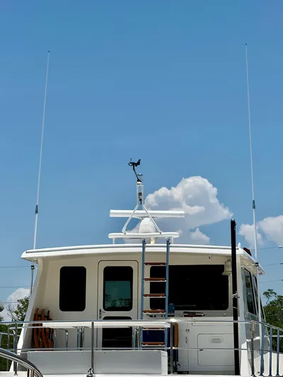 Forever Fun Yacht Photos Pics Marlow 53E CB yacht, 2018 model, with antennas against a clear blue sky.