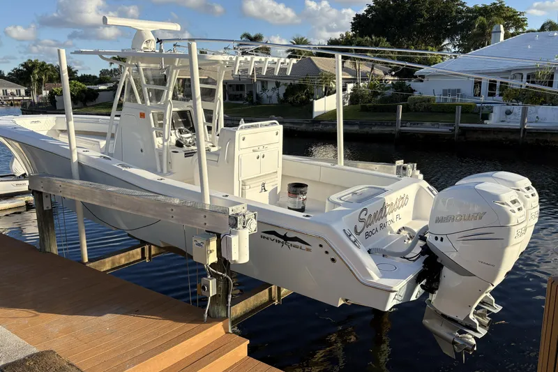 Sandtastic Yacht Photos Pics 2020 Invincible 33 Open Fisherman boat docked with Mercury outboard engine.