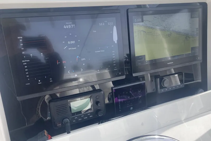 Sandtastic Yacht Photos Pics Dashboard of 2020 Invincible 33 Open Fisherman with Garmin navigation displays.