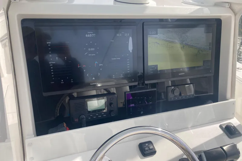 Sandtastic Yacht Photos Pics Dashboard of 2020 Invincible 33 Open Fisherman with Garmin navigation displays.