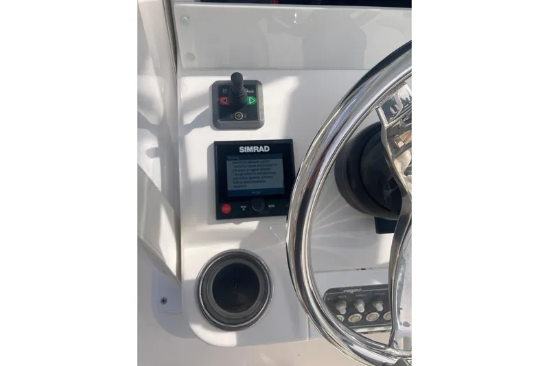 Sandtastic Yacht Photos Pics Control panel of 2020 Invincible 33 Open Fisherman with Simrad display and joystick.
